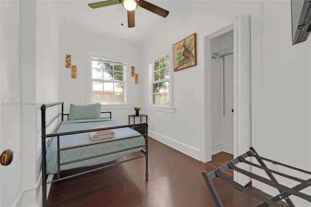 a view of room with window and wooden floor