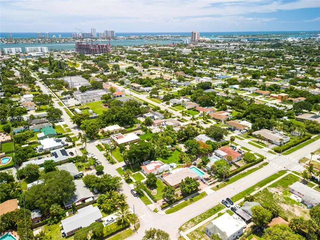 an aerial view of residential houses with outdoor space