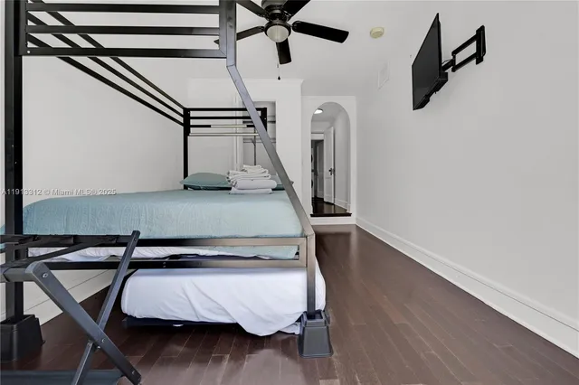 a view of a room with wooden floor and stairs