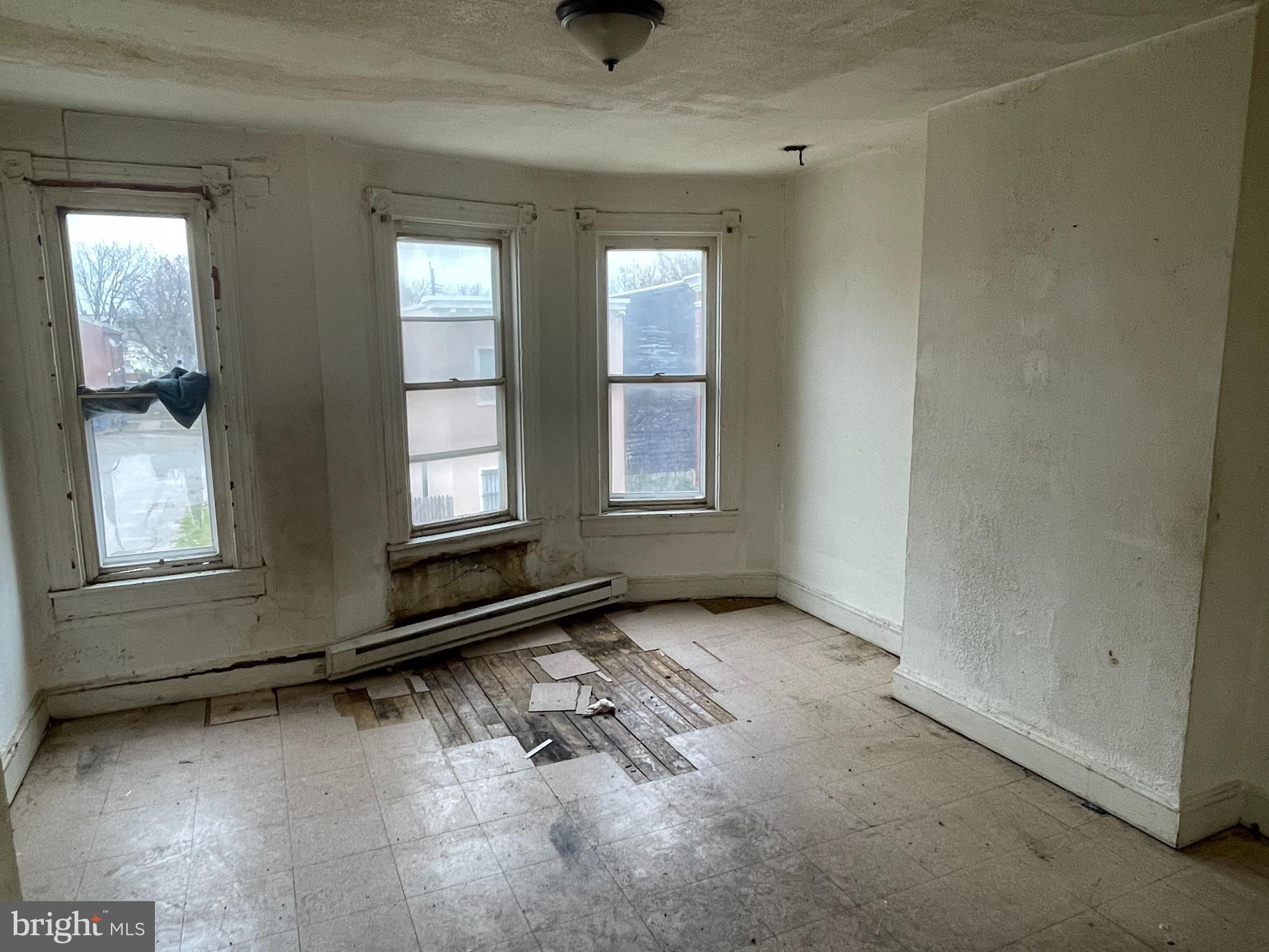 1822 Aiken Street Baltimore, MD 21213 - Photo 11 of 22 an empty room with windows