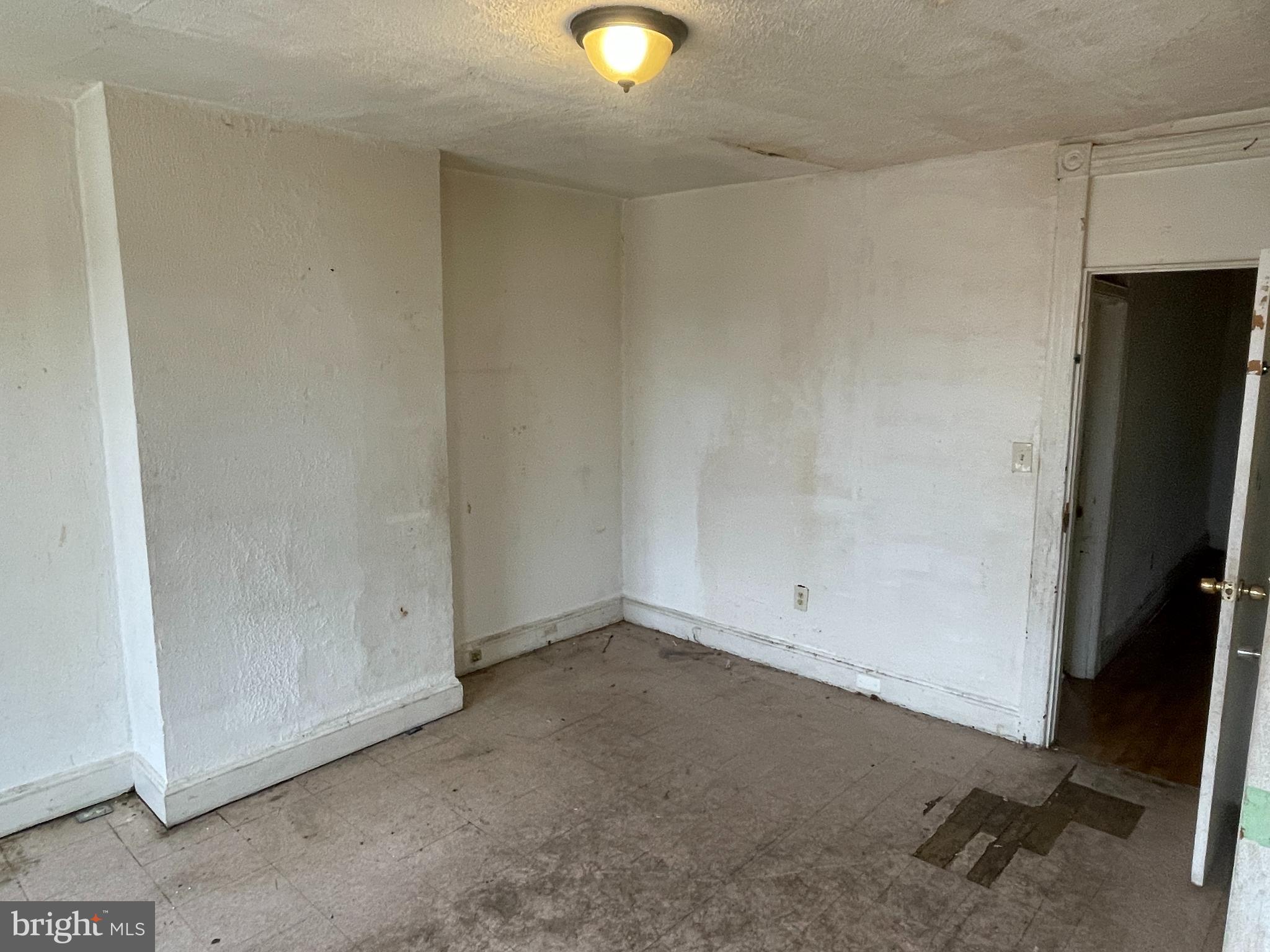 1822 Aiken Street Baltimore, MD 21213 - Photo 12 of 22 a view of an empty room and window