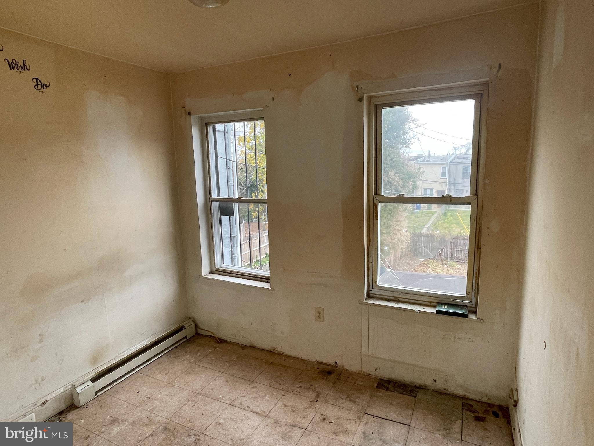 1822 Aiken Street Baltimore, MD 21213 - Photo 15 of 22 an empty room with windows