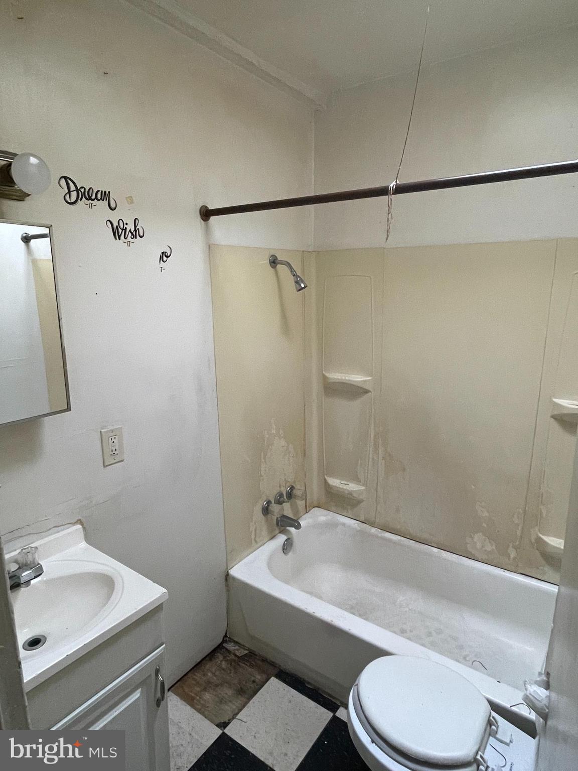 1822 Aiken Street Baltimore, MD 21213 - Photo 16 of 22 a bathroom with a sink toilet and shower