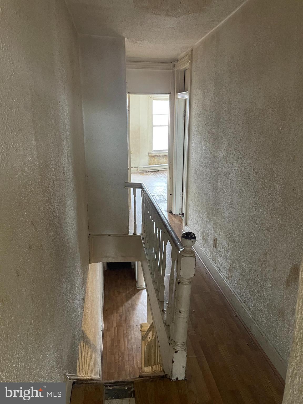 1822 Aiken Street Baltimore, MD 21213 - Photo 10 of 22 a view of entryway with wooden floor