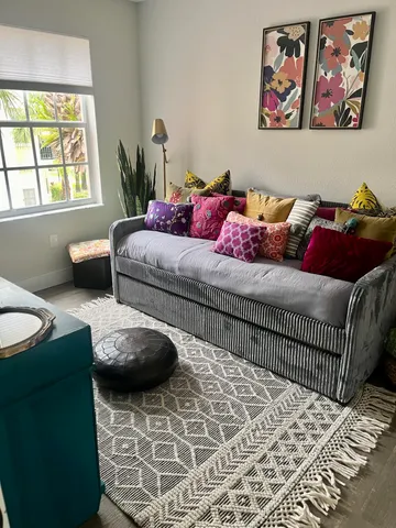 a bedroom with furniture and a window