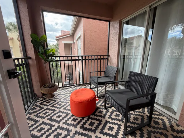 a view of a porch with furniture and a window