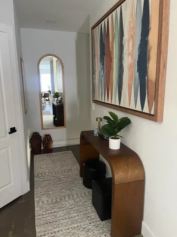 a view of a living room and a balcony