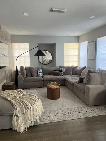 a living room with furniture and a window