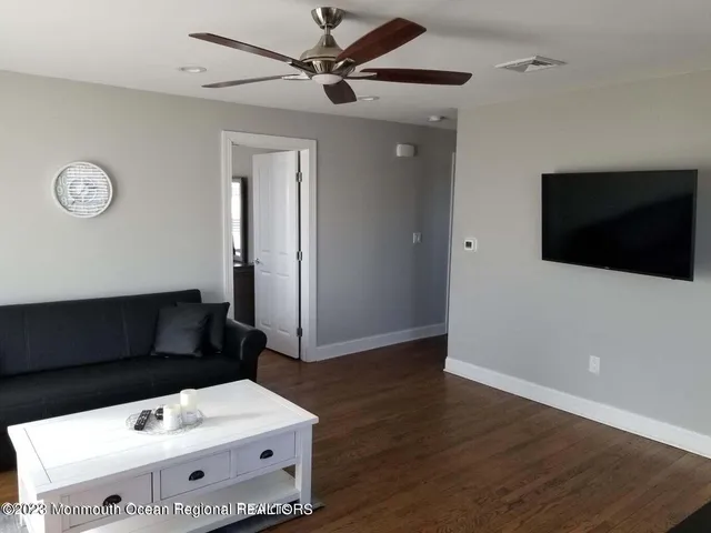 a living room with a flat screen tv