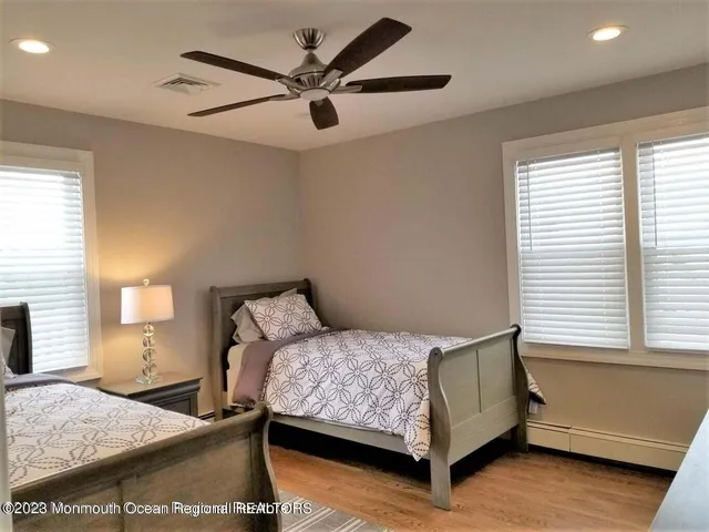 a bedroom with a large bed and a window