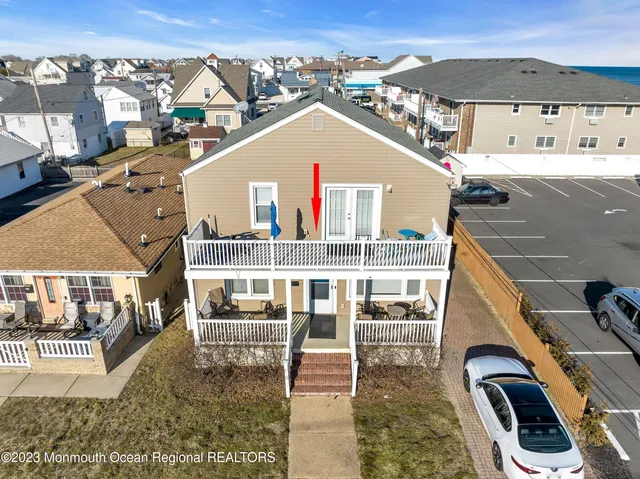 a aerial view of a house with a yard