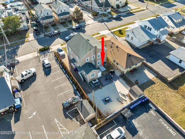 an aerial view of a house with sitting area