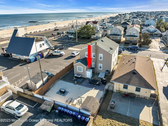 an aerial view of a house with a ocean view