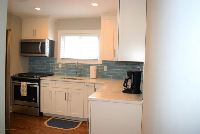 a kitchen with a stove and a microwave