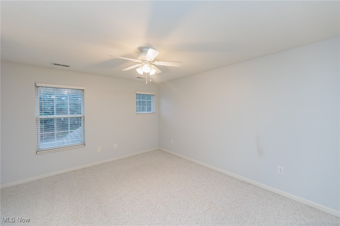 28360 Center Ridge Road, Unit 2210 Westlake, OH 44145 - Photo 34 of 45 Carpeted empty room featuring ceiling fan