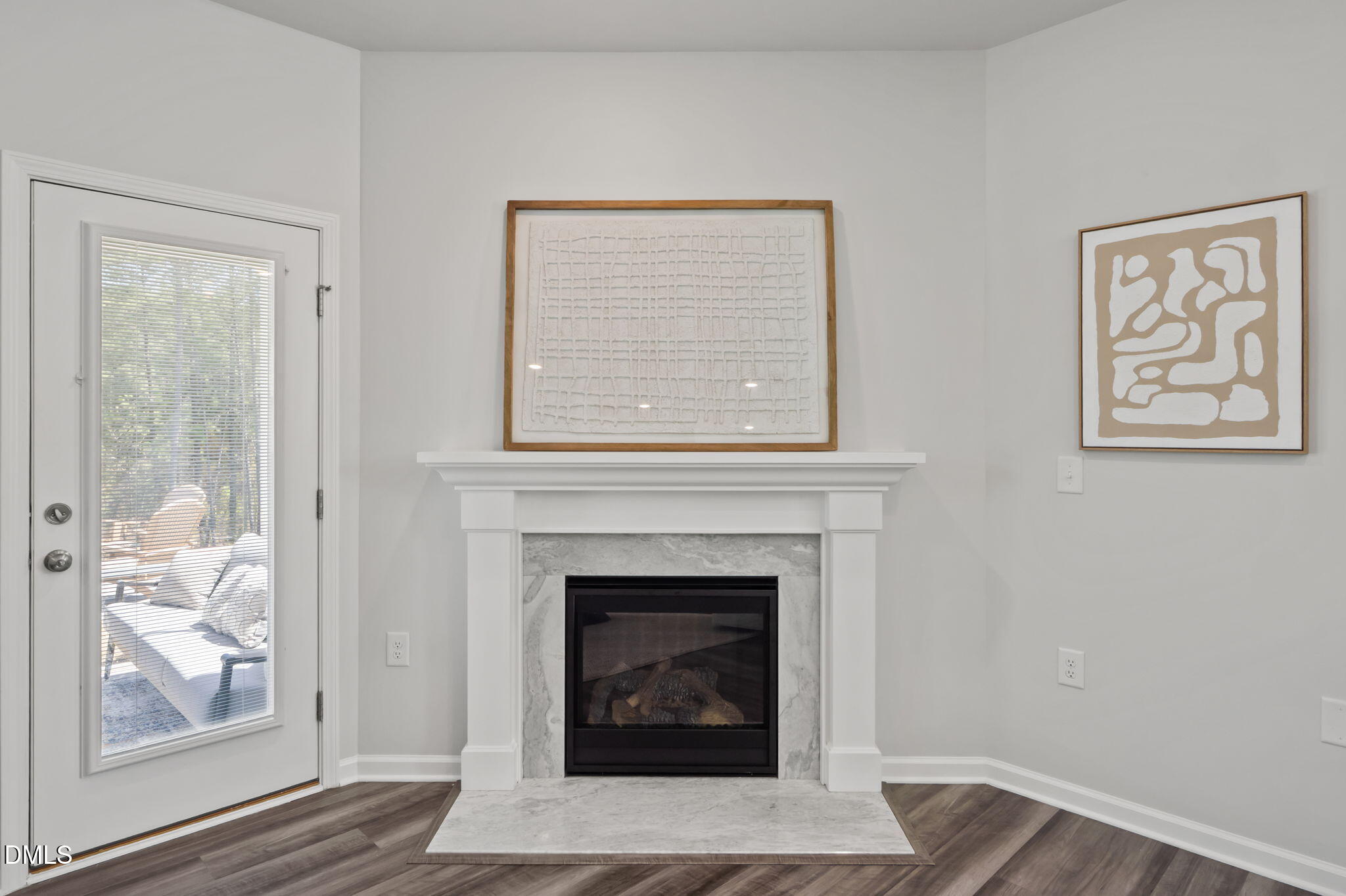 1050 Gentle Reed Drive Durham, NC 27703 - Photo 13 of 37 a living room with a fireplace and wooden floor