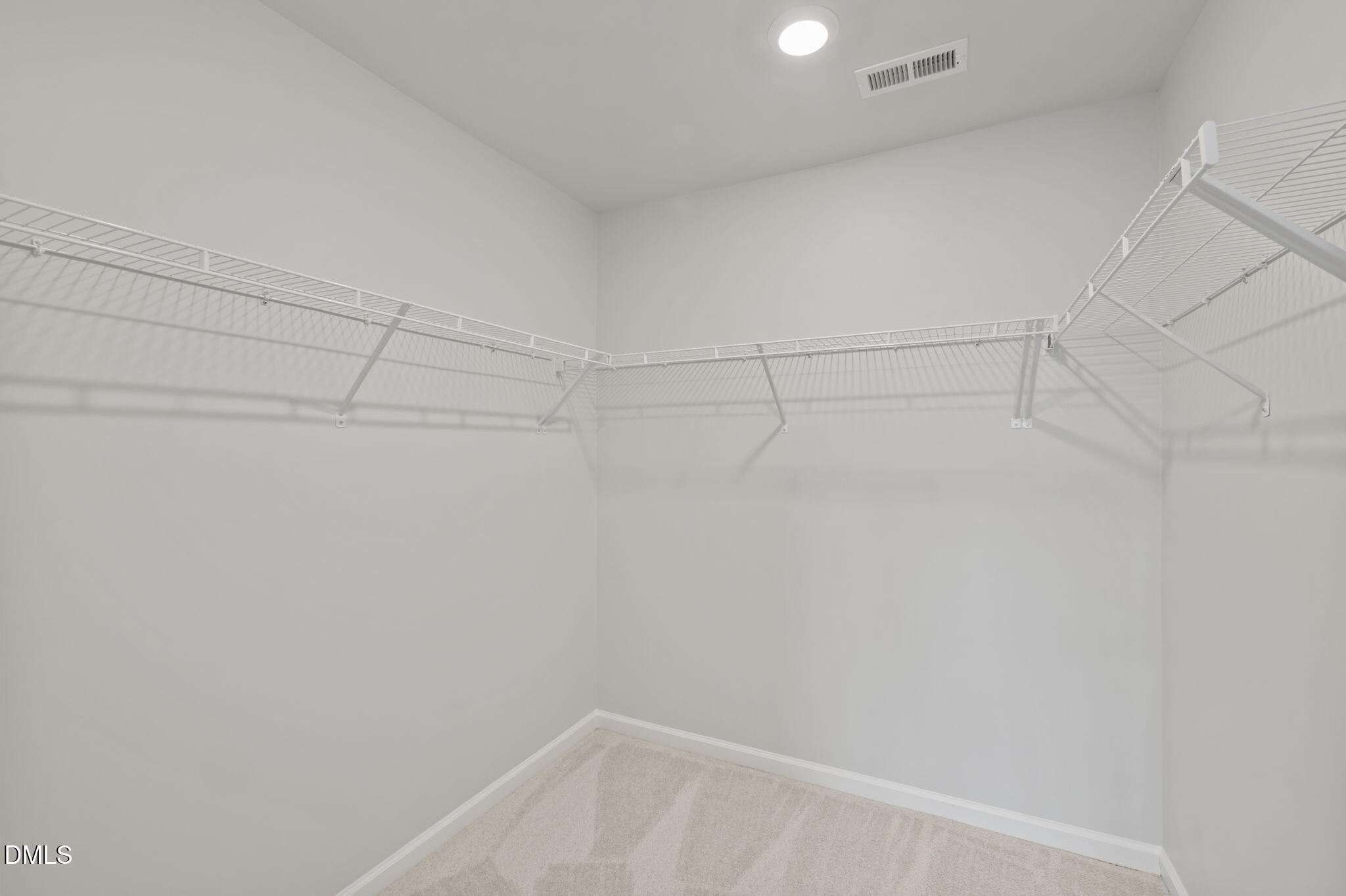1050 Gentle Reed Drive Durham, NC 27703 - Photo 17 of 37 a view of a room with racks on the wall