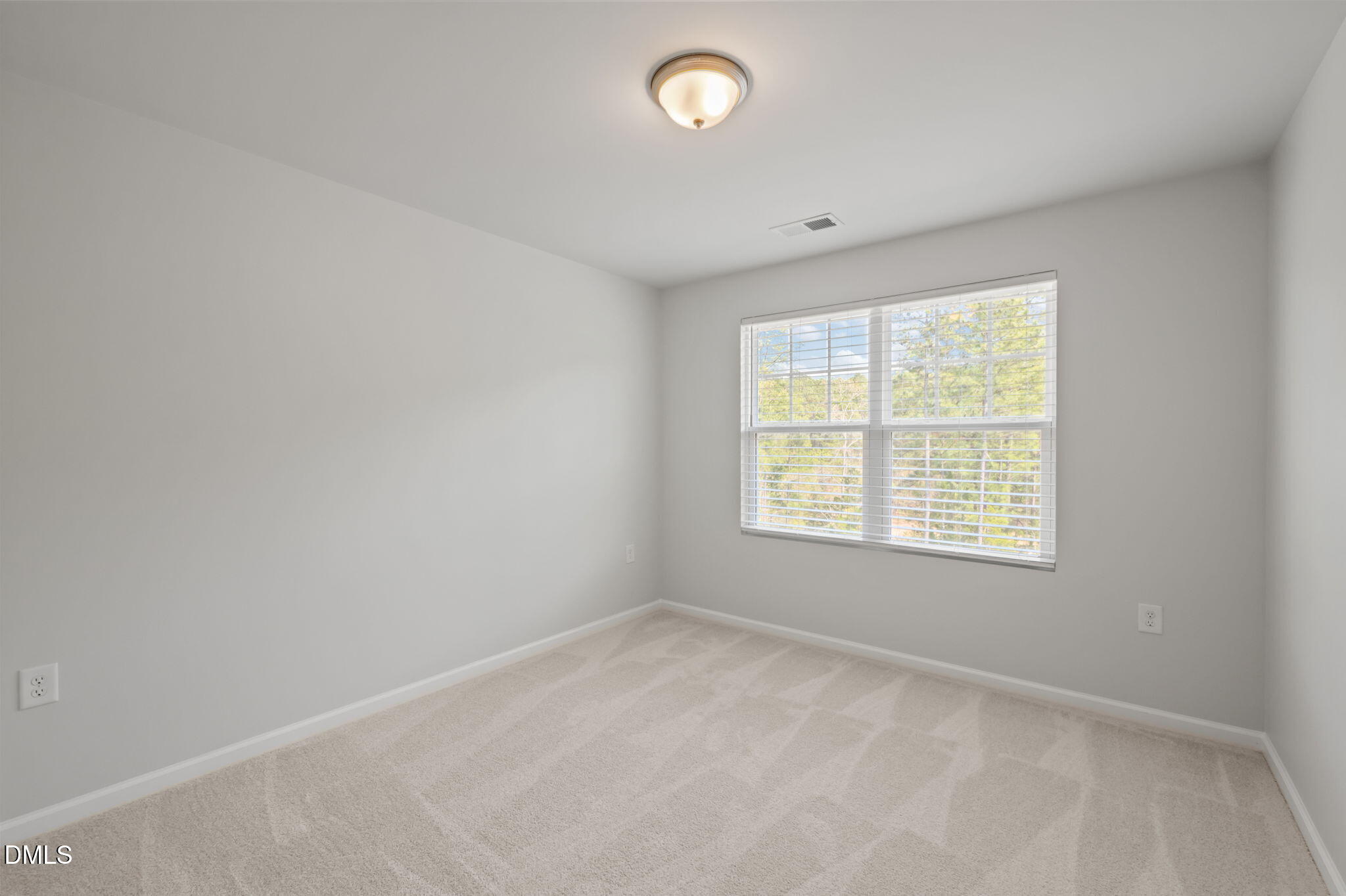 1050 Gentle Reed Drive Durham, NC 27703 - Photo 21 of 37 an empty room with a window