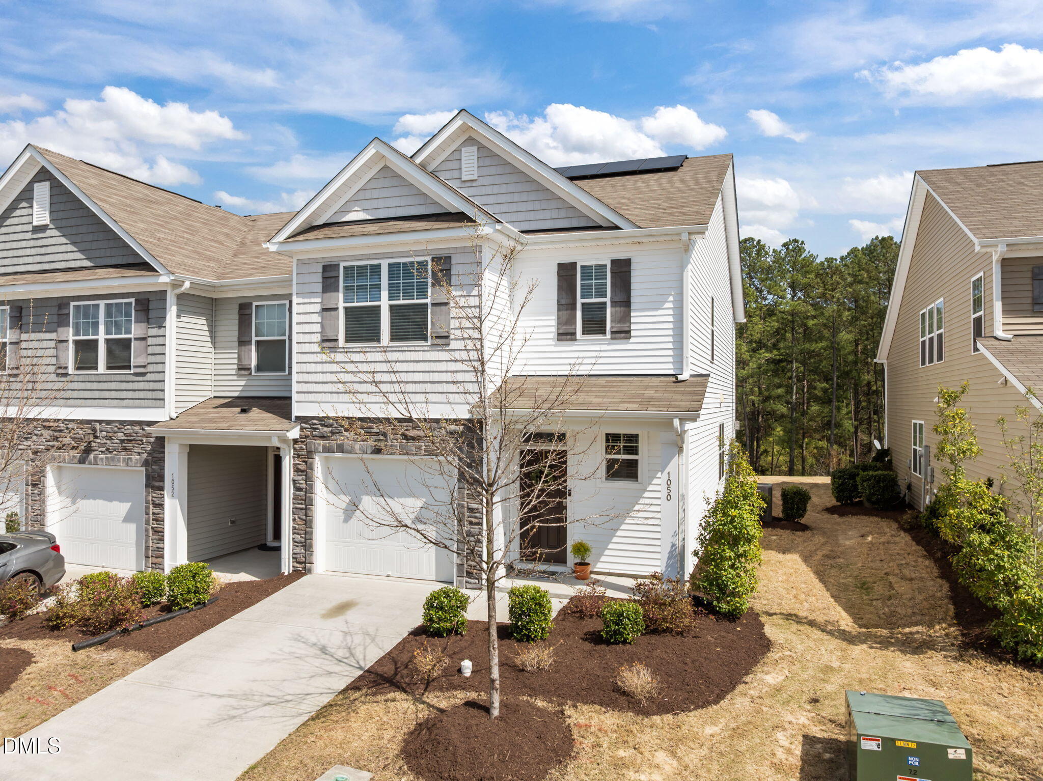 1050 Gentle Reed Drive Durham, NC 27703 - Photo 2 of 37 a front view of a house with garden