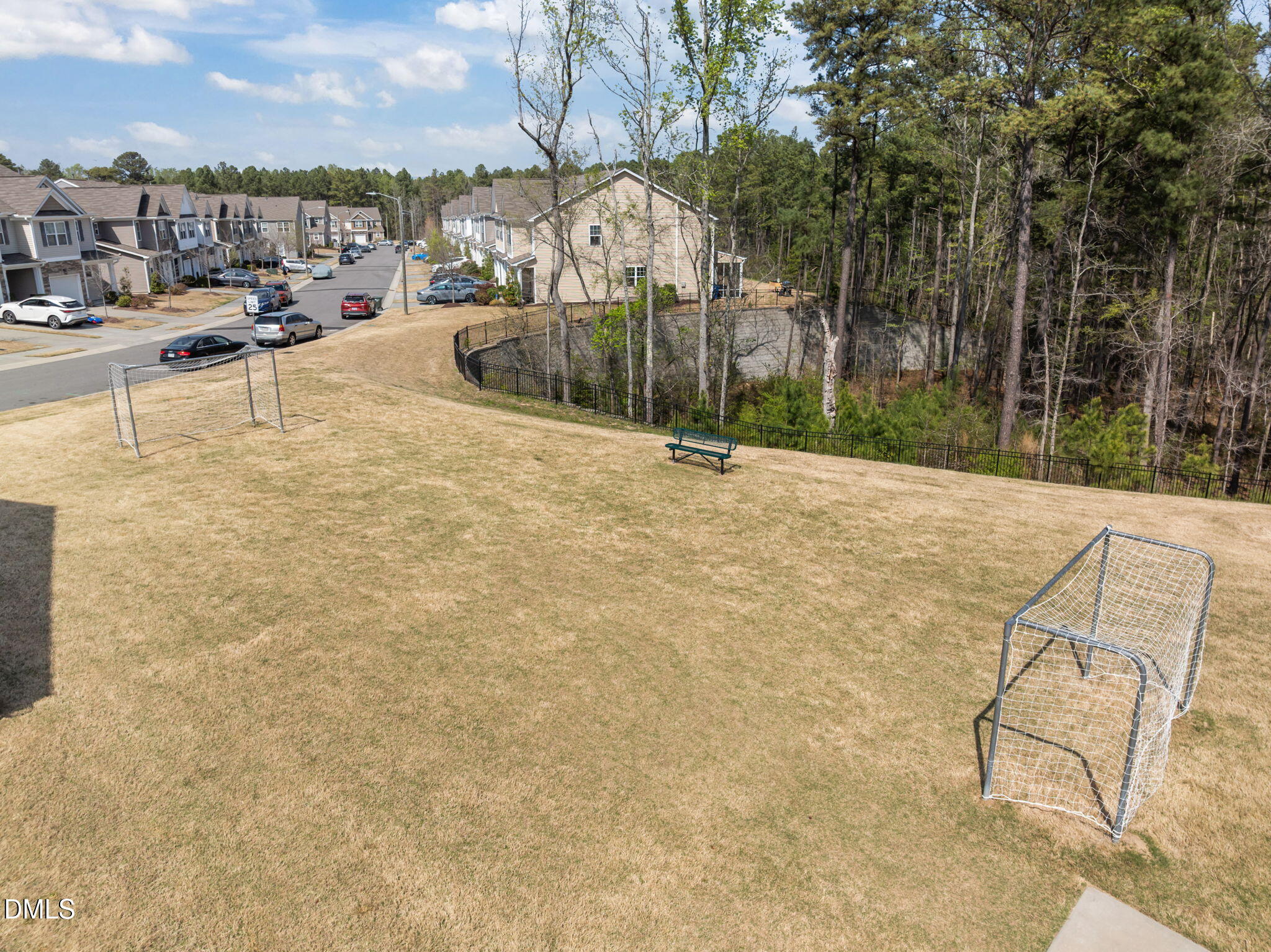 1050 Gentle Reed Drive Durham, NC 27703 - Photo 35 of 37 a view of a swimming pool with a lounge chairs