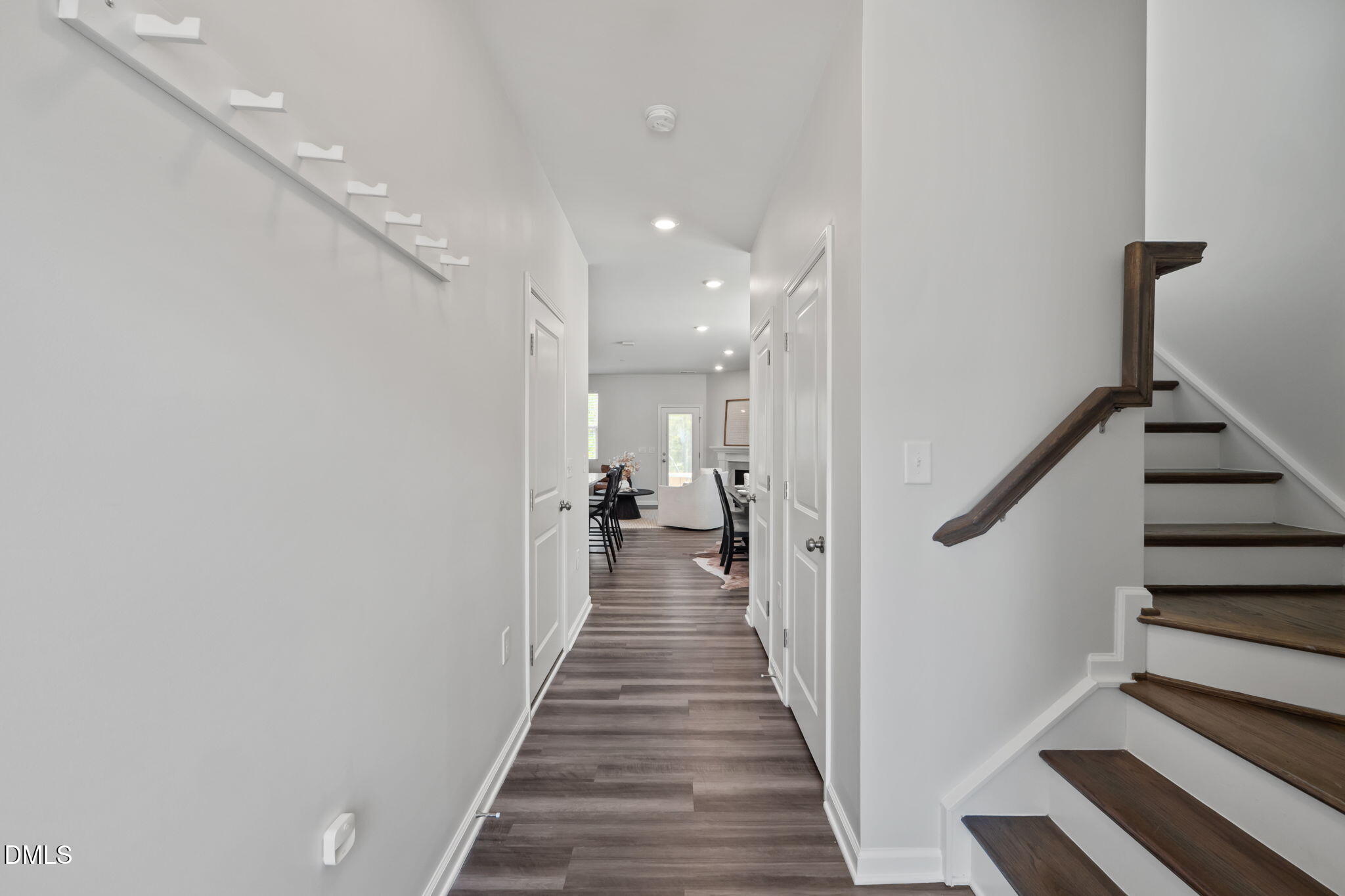 1050 Gentle Reed Drive Durham, NC 27703 - Photo 3 of 37 a view of a hallway with wooden floor and staircase