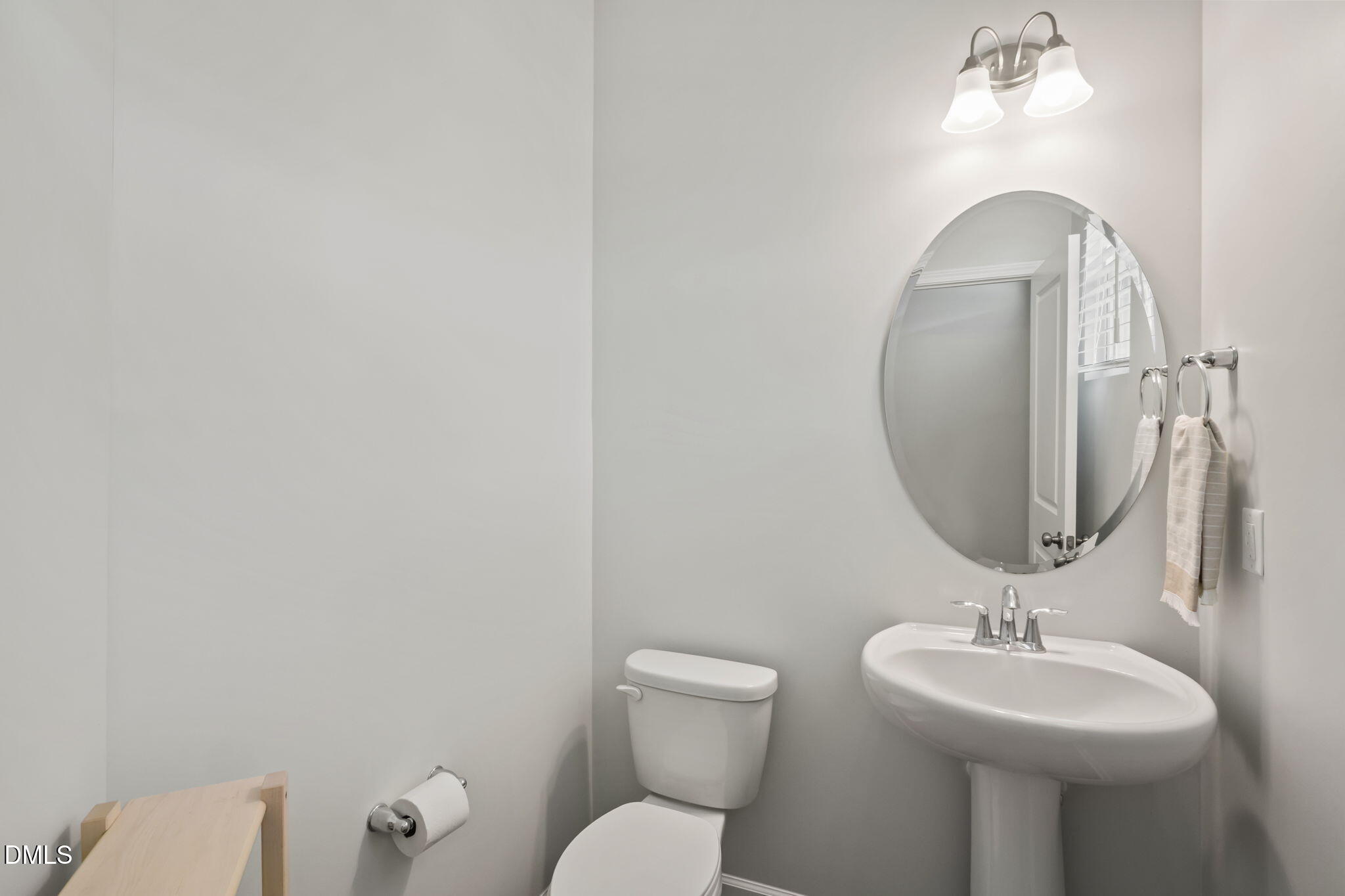 1050 Gentle Reed Drive Durham, NC 27703 - Photo 4 of 37 a bathroom with a toilet sink and mirror