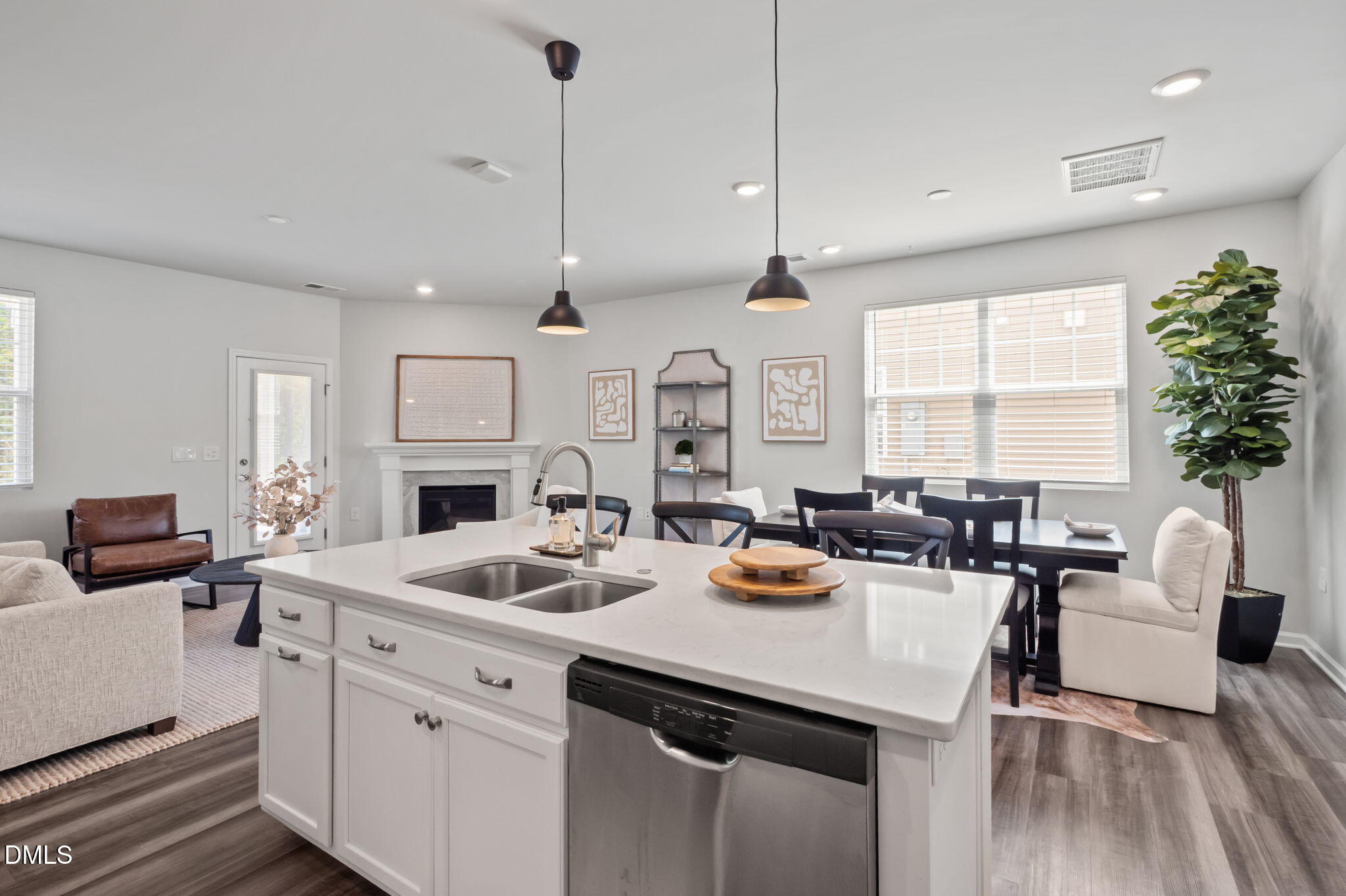 1050 Gentle Reed Drive Durham, NC 27703 - Photo 8 of 37 a view of kitchen a sink dining table and chairs