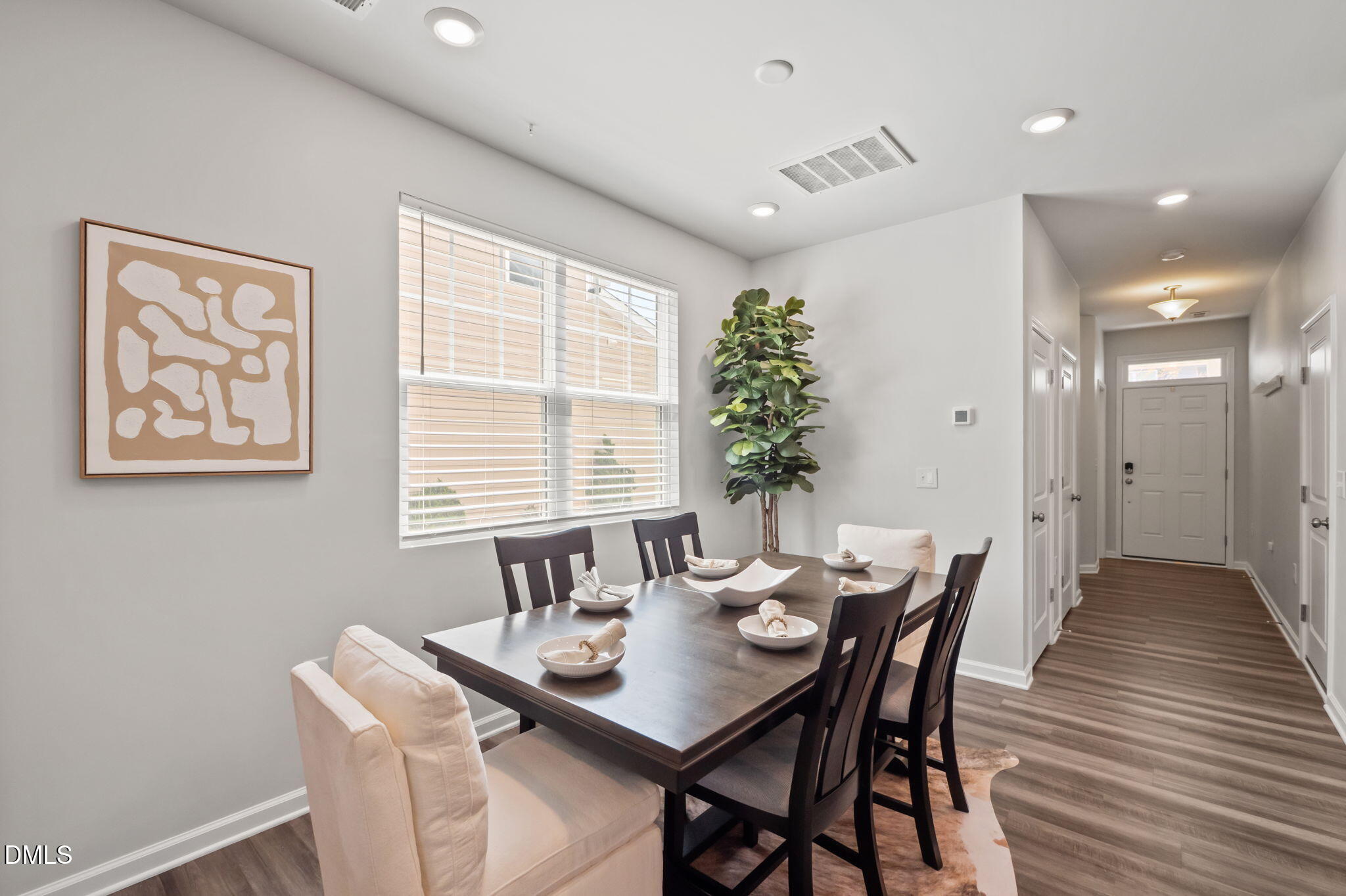 1050 Gentle Reed Drive Durham, NC 27703 - Photo 9 of 37 a view of a dining room with furniture and wooden floor