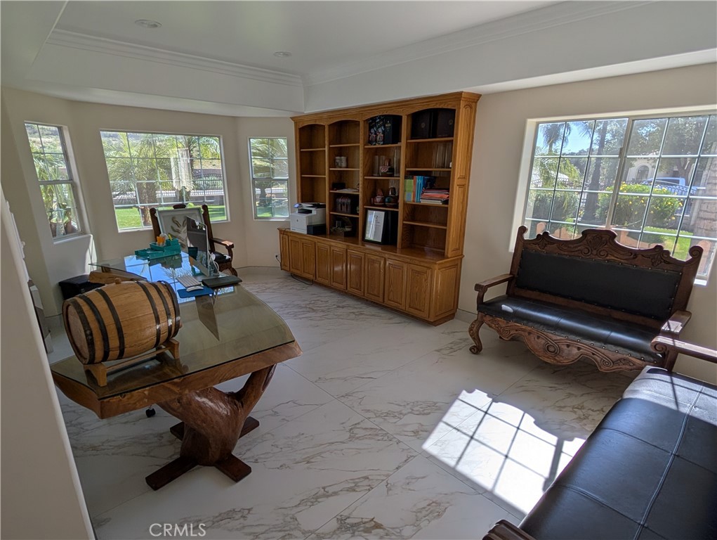 1719 Crystal Ridge Court Riverside, CA 92506 - Photo 11 of 60 a living room with furniture and a floor to ceiling window