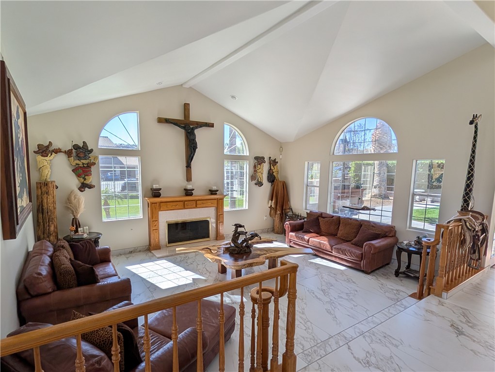 1719 Crystal Ridge Court Riverside, CA 92506 - Photo 12 of 60 a living room with furniture a fireplace and a large window