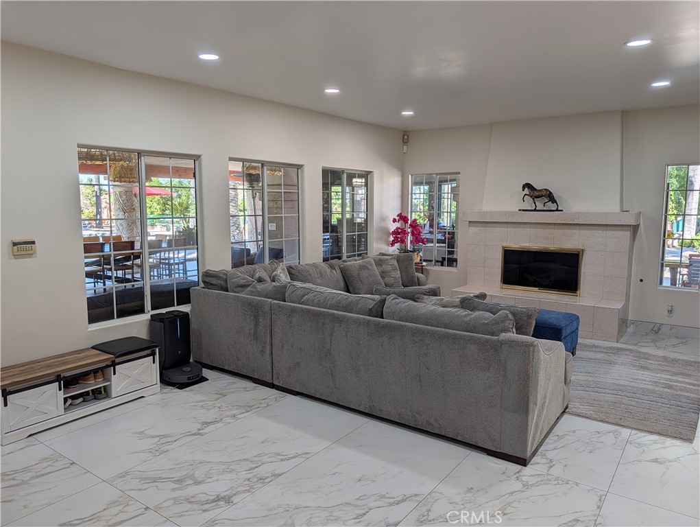 1719 Crystal Ridge Court Riverside, CA 92506 - Photo 19 of 60 a living room with furniture and a fireplace
