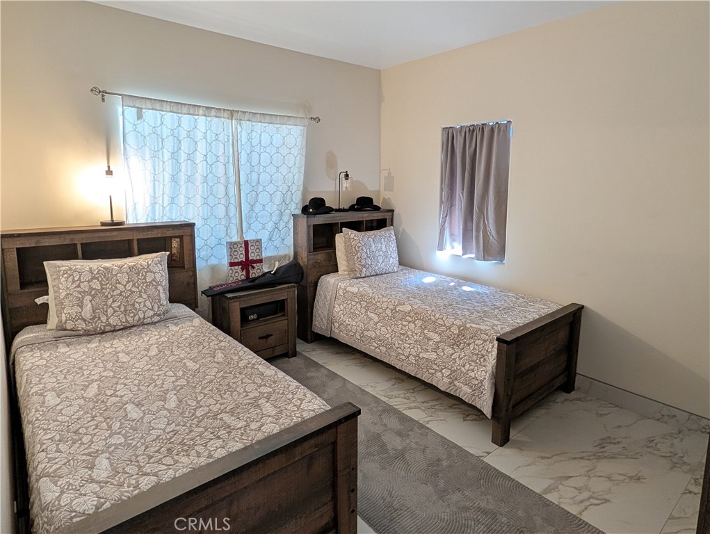 1719 Crystal Ridge Court Riverside, CA 92506 - Photo 21 of 60 a bedroom with a bed and window