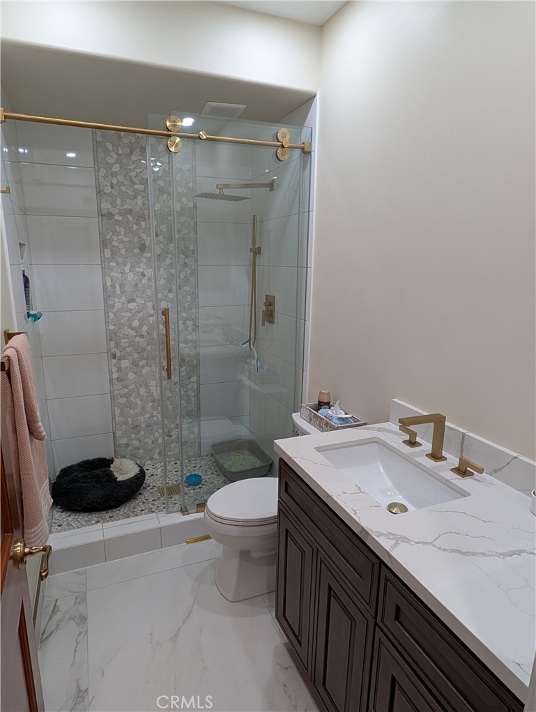 1719 Crystal Ridge Court Riverside, CA 92506 - Photo 22 of 60 a bathroom with a sink a toilet and shower