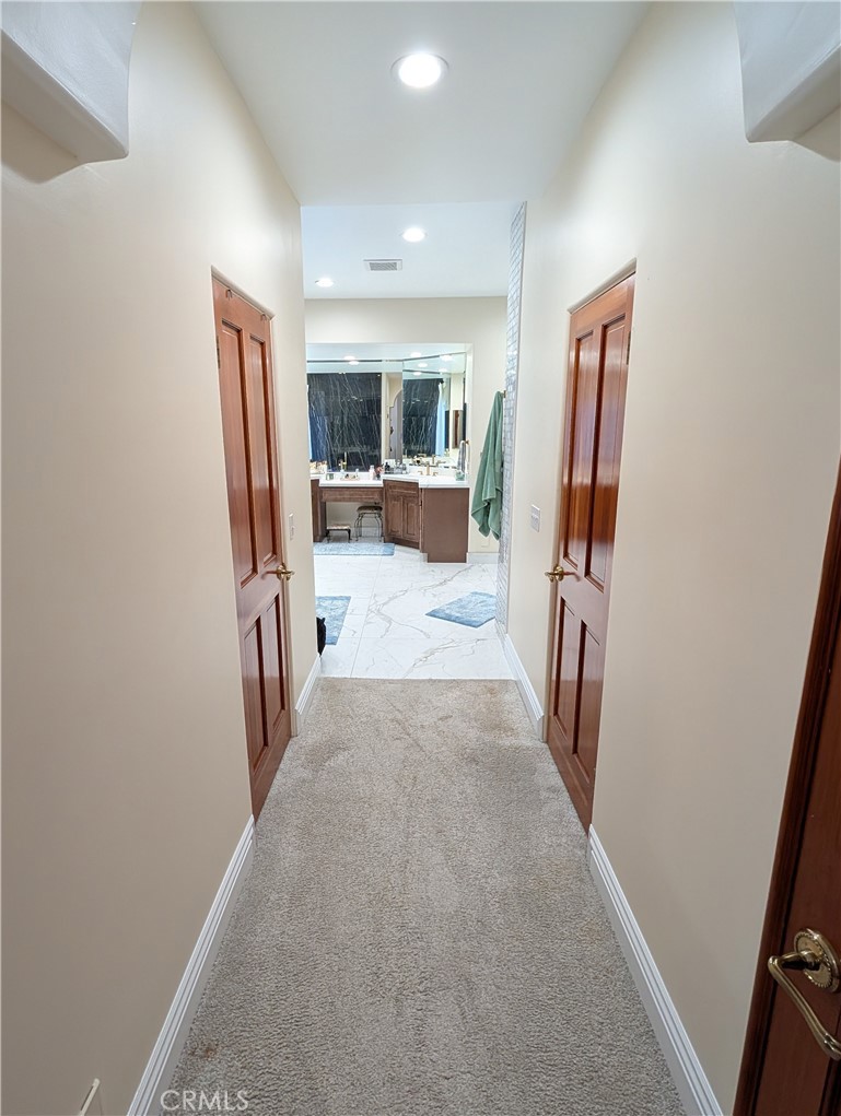 1719 Crystal Ridge Court Riverside, CA 92506 - Photo 28 of 60 a view of a hallway with furniture and a window