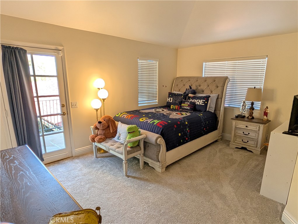 1719 Crystal Ridge Court Riverside, CA 92506 - Photo 36 of 60 a bed room with a bed and a chair