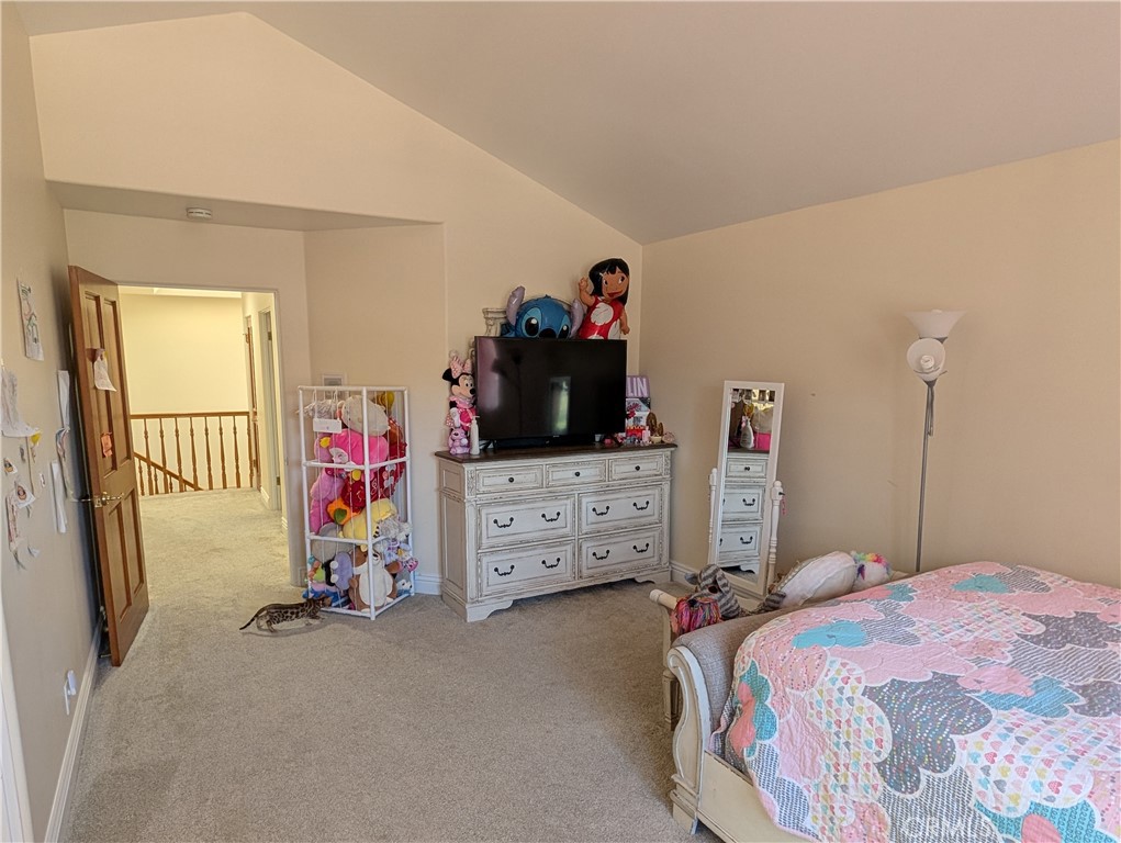 1719 Crystal Ridge Court Riverside, CA 92506 - Photo 38 of 60 a bedroom with a bed and a chandelier