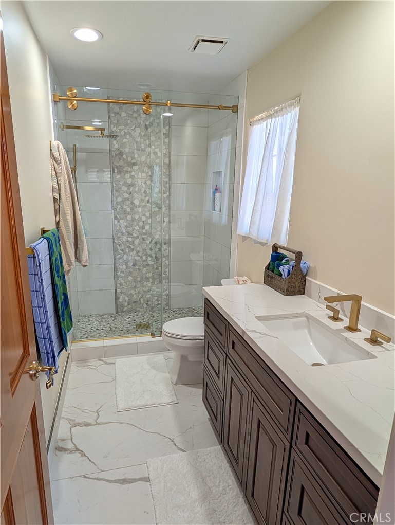 1719 Crystal Ridge Court Riverside, CA 92506 - Photo 40 of 60 a bathroom with a tub sink toilet and shower