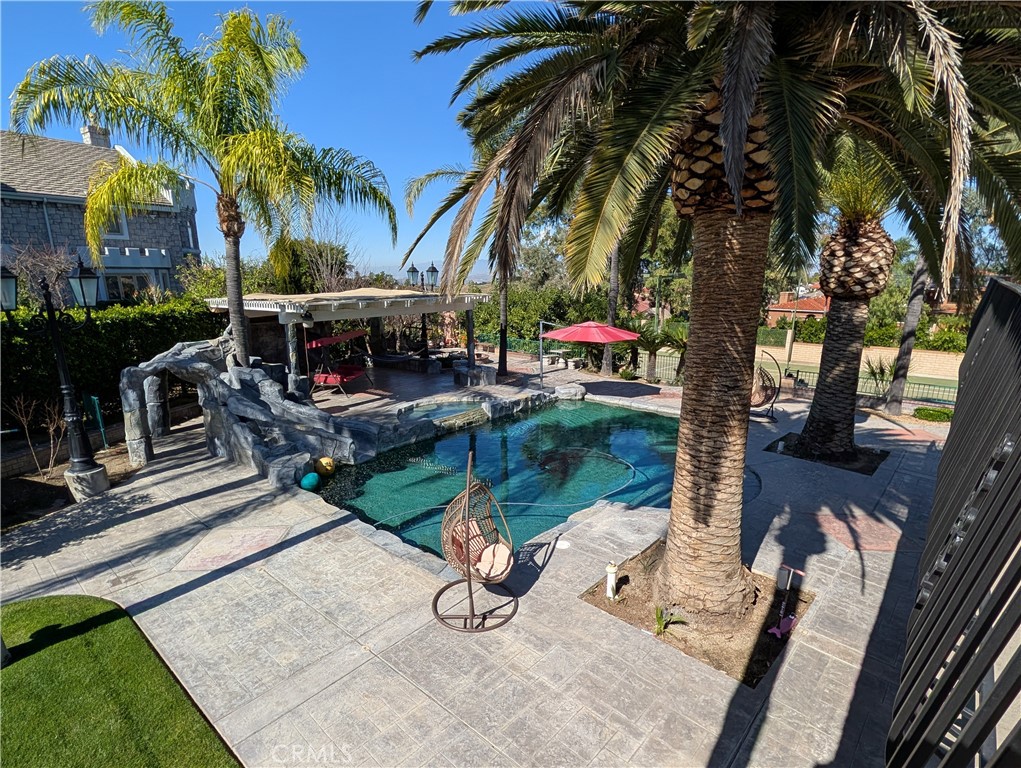 1719 Crystal Ridge Court Riverside, CA 92506 - Photo 49 of 60 a view of swimming pool with chairs