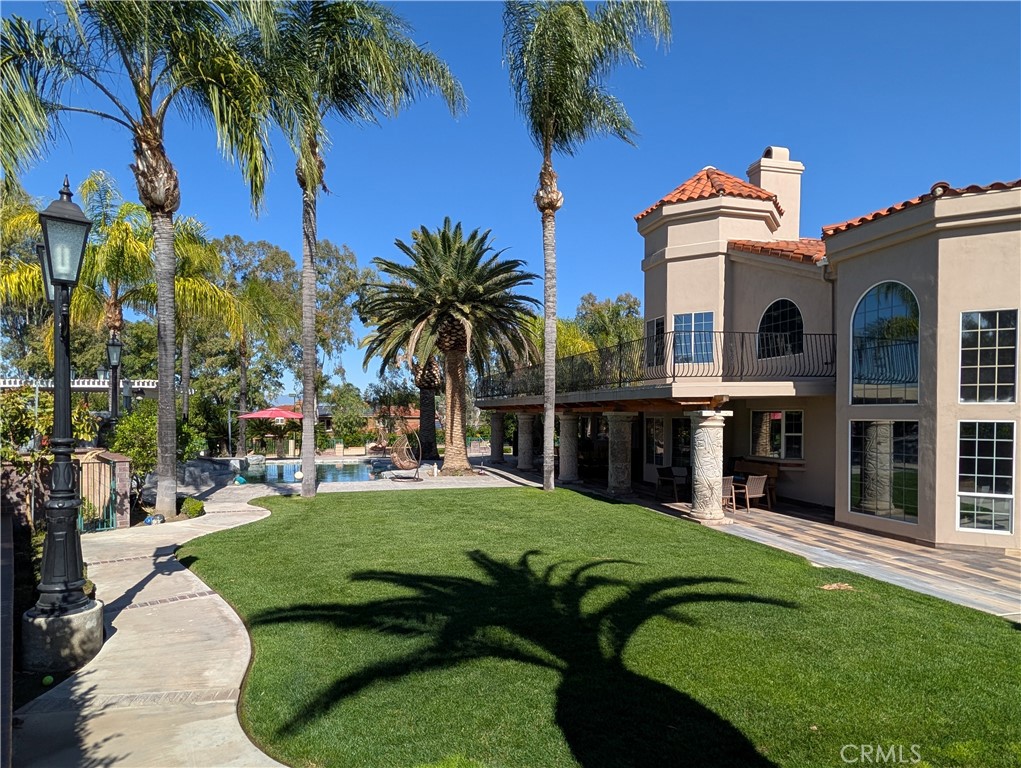 1719 Crystal Ridge Court Riverside, CA 92506 - Photo 57 of 60 a front view of a house with a garden and trees