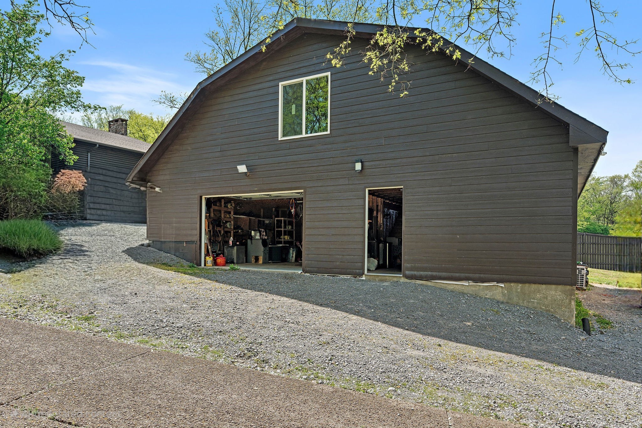 5521 Cane Ridge Road Antioch, TN 37013 - Photo 32 of 32 a front view of a house with a yard and garage
