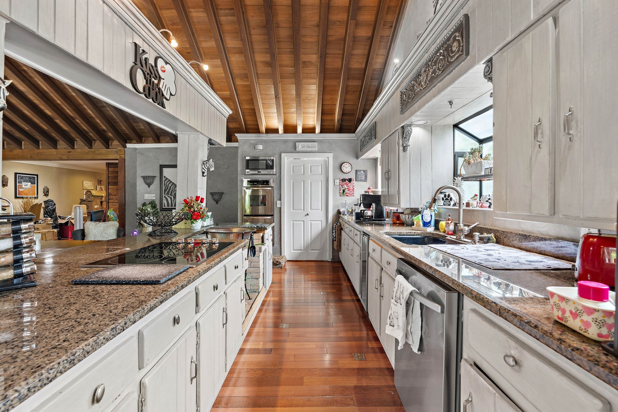 5521 Cane Ridge Road Antioch, TN 37013 - Photo 10 of 32 a large kitchen with stainless steel appliances granite countertop a large stove a sink dishwasher and cabinets with wooden floor