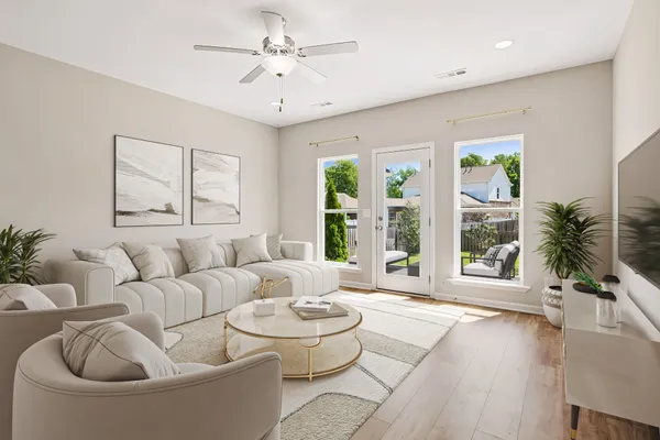 a living room with furniture and a large window