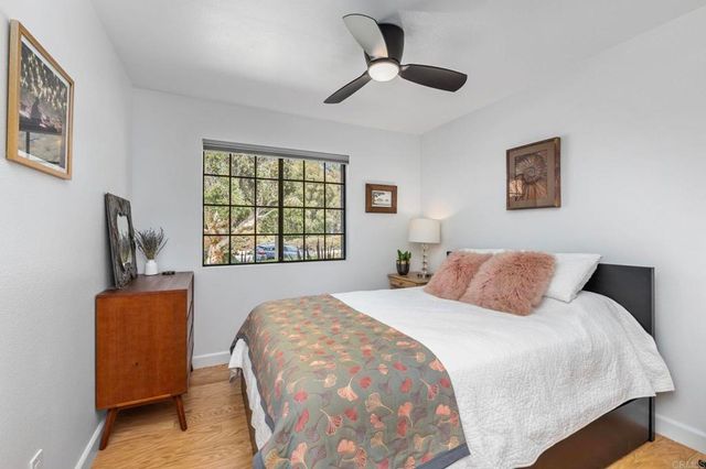 a bedroom with a large bed and a window