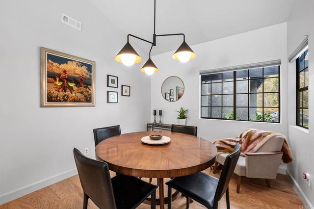 a view of a dining room with furniture and window