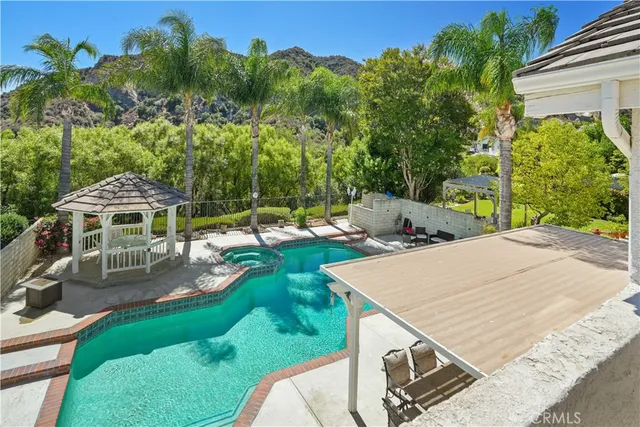 an outdoor space with furniture and garden