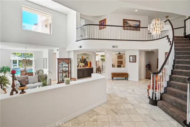 a view of living room filled with furniture and furniture