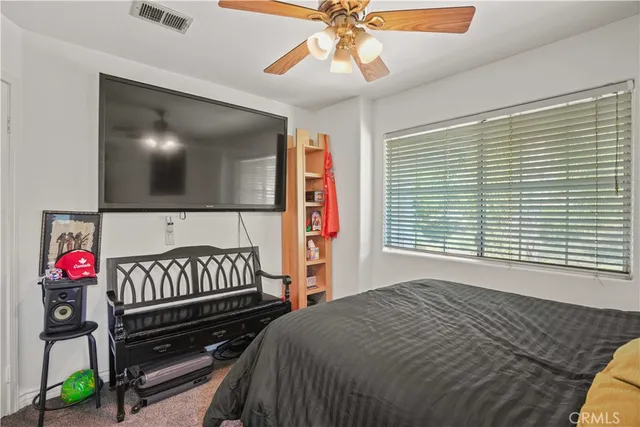 a bedroom with furniture and a window