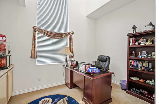 a room with furniture and book shelf