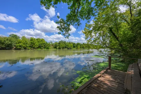 a view of a lake with a yard