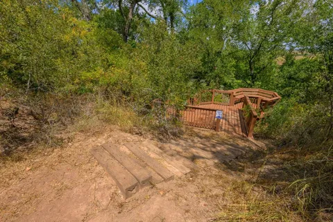 a backyard of a house with table and chairs